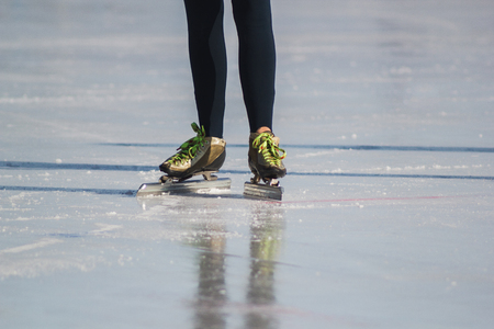 Ice skates, winter sport - green colourful bootsの写真素材