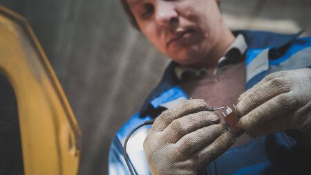 Work of automotive electrician - checking electro components in carの写真素材