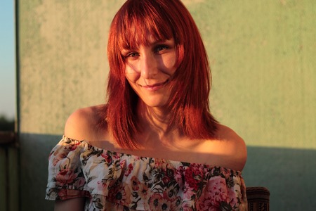 Portrait of a cute young female at sunsetの写真素材