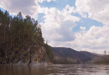 Summer landscape with mountains, forest and a riverの写真素材
