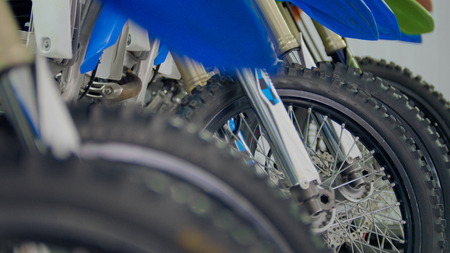 Wheels of motorcycle in the garage - enduro cross motorbike