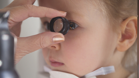Optometrist checking little childs vision - macro shotの写真素材