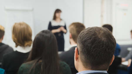 Blurred business concept background - a lot of people sitting at a seminar or lecturesの写真素材