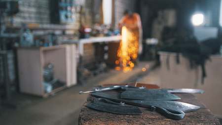 De-focused workshop - grinding iron knifes with sparklesの写真素材