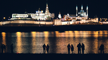 Kazan, Russia, 12 may 2017 - Kazan kremlin with reflection in river at night and silhouettes of peopleのeditorial素材