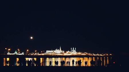Kazan, Russia, 12 may 2017 - Kazan kremlin with reflection in river at night with silhouettes of peopleのeditorial素材
