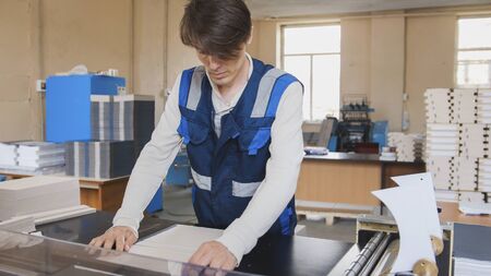 Press operator over a clean sheet of paper