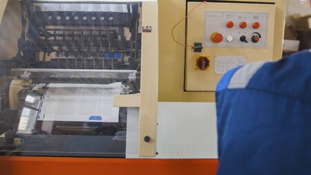 A printing machine controlled by a print operatorの写真素材