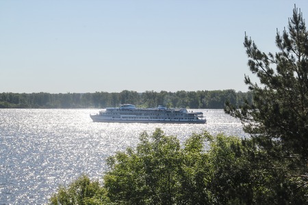 Passenger ship floating on the wide riverの写真素材