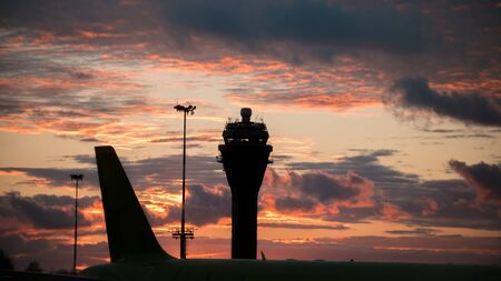 Sunset at International airport - control towerの写真素材