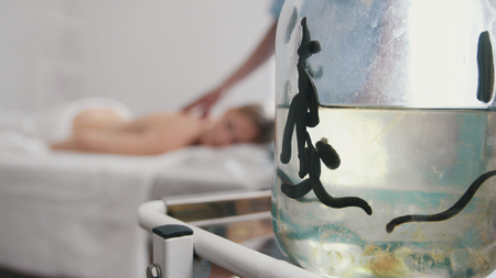 Glass jar with black medical leeches. Tibetan Medicineの写真素材