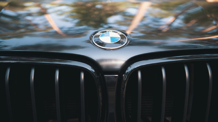 Kazan, RUSSIA july 2017: the hood of the automobile BMW with sign logo on black car - popular luxury sport carのeditorial素材