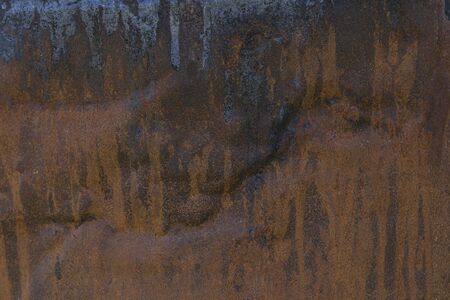 Rusted iron plate with leaking engine oil - background
