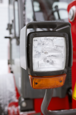 Headlight of a truck on the frozen winter roadの写真素材