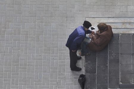 Two beggars near orthodox church in Russiaの写真素材