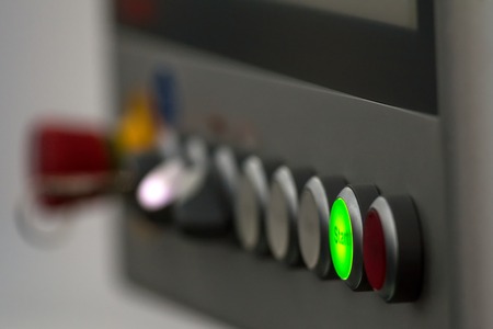 Energy security - system management panel. Red power button - industrial remote control.の写真素材