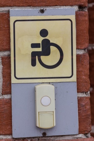 Disabled entry push button - sign on rail way stationの写真素材