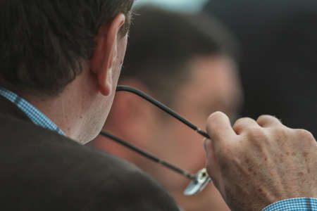 Senior businessman with eyeglasses at presentations or lecture, close upの写真素材