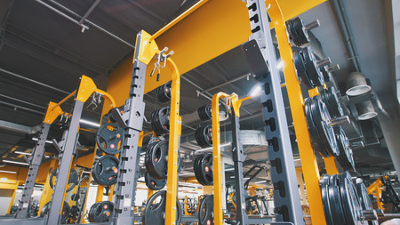 Interior Of Modern Fitness Gym - a lot of modern athletic trainerの写真素材