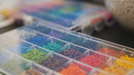 Colorful plastic granules on extruder for making plastics on extrusion manufactoryの写真素材