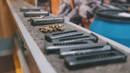 Pistol clips with bullets in shooting gallery