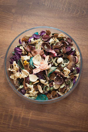 Dried flowers and herbs in glass plate - aromatherapyの写真素材