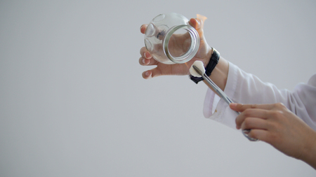 Spa. In the massage bank create a vacuum against the background of a girlの写真素材