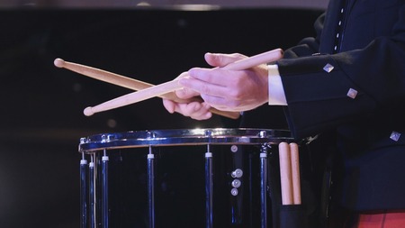 Drum performer plays drumstick at the stageの写真素材
