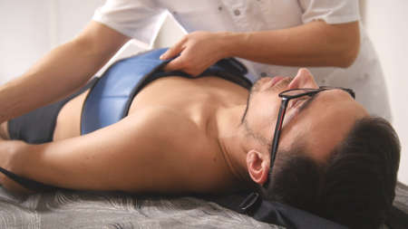 Osteopathic doctor perform procedure, stretching the spine, chiropractic, Asian Tibetan medicineの写真素材