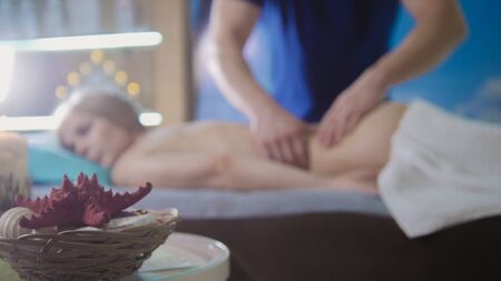 Massage parlor - young girl gets relaxing healing therapy, de-focusedの写真素材