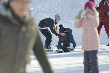 Girls Teens having fun at winter skate ringの写真素材