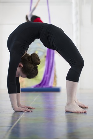 Young attractive woman standing in bridge exercise