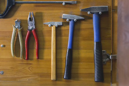 Working tools spread out on the wooden tableの写真素材