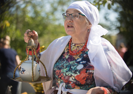 20 August 2018, Krasnovidovo, Russia - old woman in russian folk clothes. portraitのeditorial素材