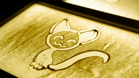 A cat drawn with a sand on the screenの写真素材