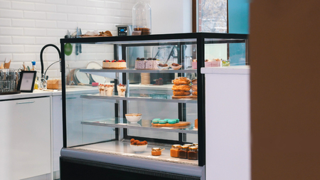 Bakery. A shop window full of sweets and desserts.の写真素材