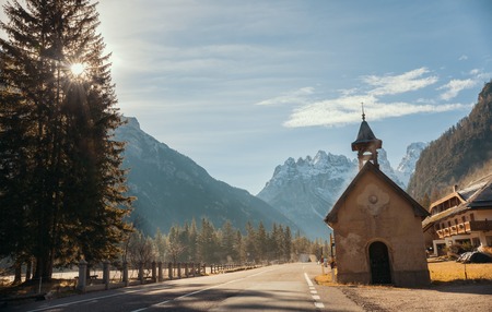 The stretch of road. A little church on the roadの写真素材