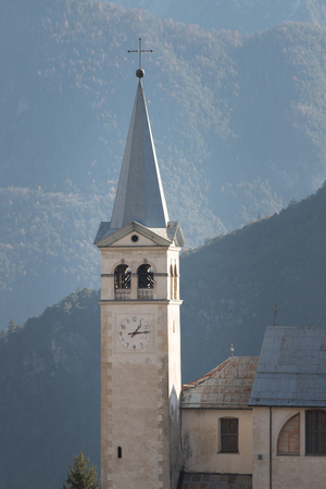 A bell tower. Church in Dolomites. Europeの写真素材
