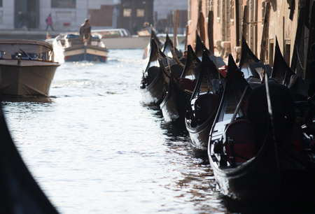 A woody canoe rests on a leash under the bridgeの写真素材