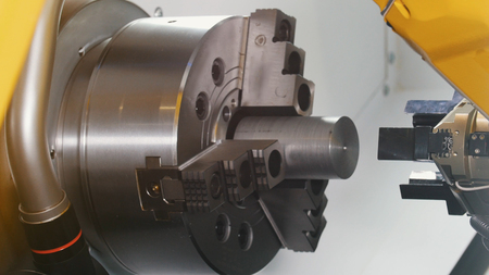 Big yellow CNC lathe connects its two partsの写真素材