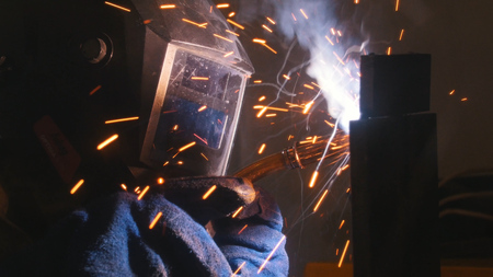 Industrial exposition. A welder doing his job. Weldingの写真素材