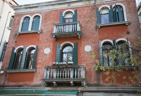 ITALY, VENICE. 11-11-2018: red apartment building in Italyのeditorial素材