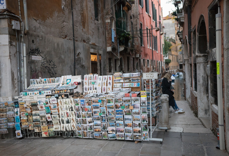 ITALY, VENICE. 11-11-2018: selling photo cards on the streetのeditorial素材
