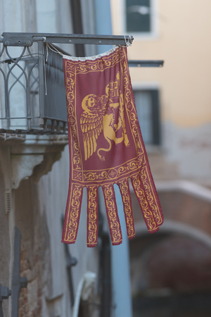 ITALY, VENICE. 11-11-2018: flag of Venice. The golden winged lion of Evangelist Markのeditorial素材