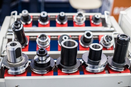 Gray Industrial machine.with a lot of red and black buttons