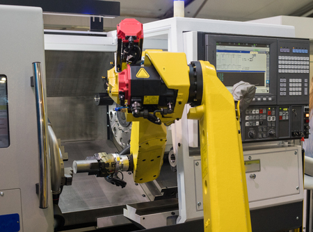 Lathe with robotic control.Machine for shaping wood, metal, or other material.