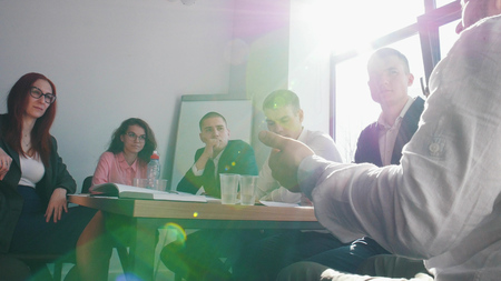 People at the business conference in the office listening to their chief