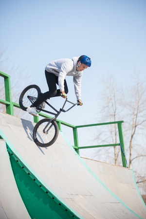 A man performs tricks on a bicycleの写真素材