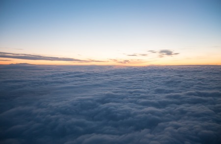 View from plane window - blue sky with white clouds, wide angleの写真素材
