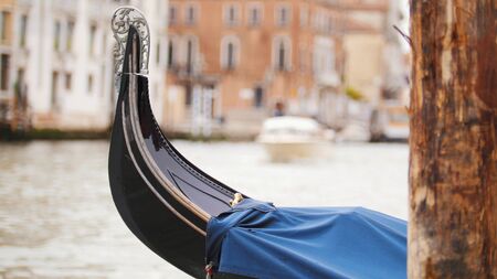 A moored boat on the water channel in Veniceの写真素材
